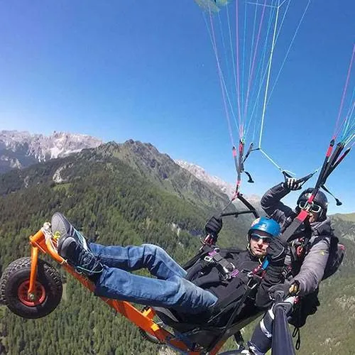 https://www.parapendiovaldifassa.com/wp-content/uploads/2024/12/paragliding-tandem-disability-flight-fassa-fly-2024-new_500x500-1.webp